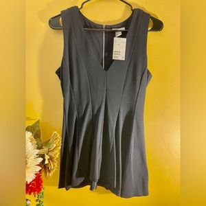 Sleeveless low cut fit then flare top